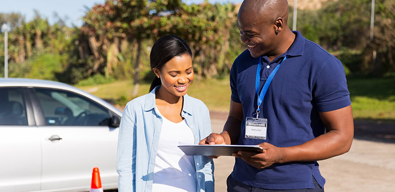 Driver's Ed Instructor teaching student in drivers ed course